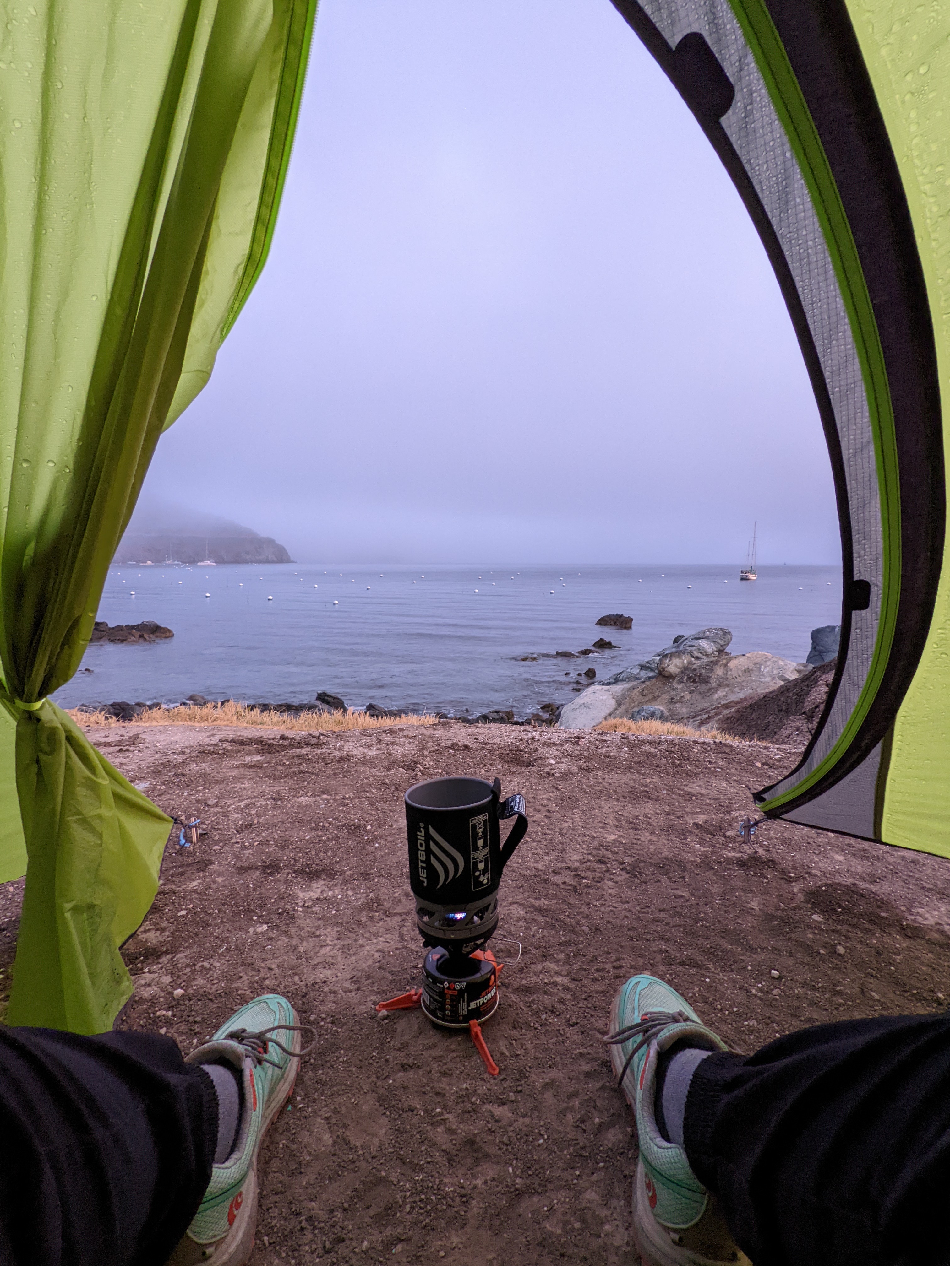 Jessica making coffee in the alcove of the tent